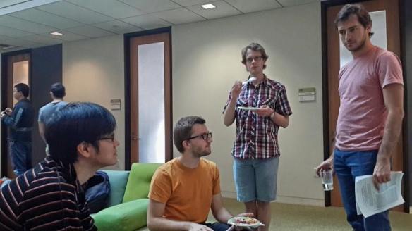 Left to right: Beni Yoshida, Aleksander Kubica, Aidan Chatwin-Davies and Fernando Pastawski discussing holographic codes.